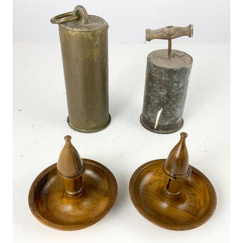 308 - TWO ARTILLERY SHELL DOOR STOPS AND AN OLIVE WOOD TRAVELLING CANDLESTICK