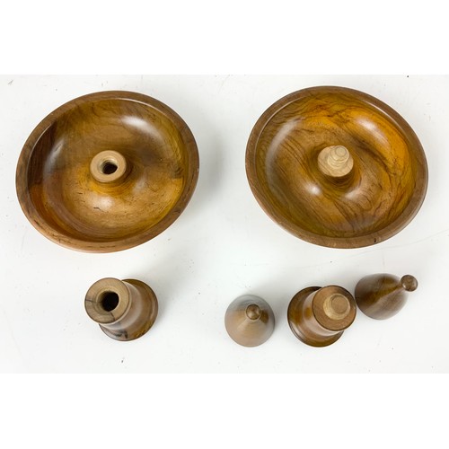 308 - TWO ARTILLERY SHELL DOOR STOPS AND AN OLIVE WOOD TRAVELLING CANDLESTICK