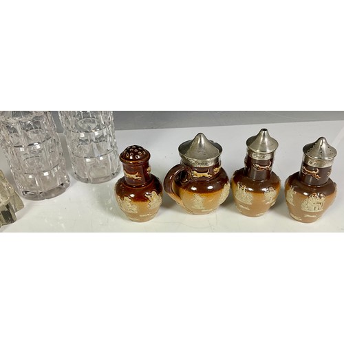 307 - CUT GLASS AND DOULTON LAMBETH CRUETS MOST WITH HALLMARKED SILVER LIDS