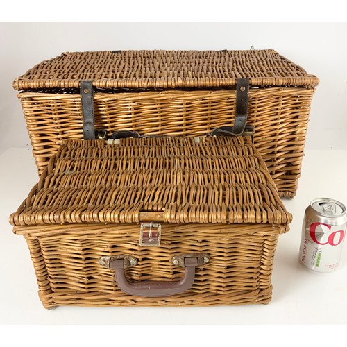 372 - TWO  WOVEN HAMPER BASKETS LARGEST 59cm x 41cm x 27cm