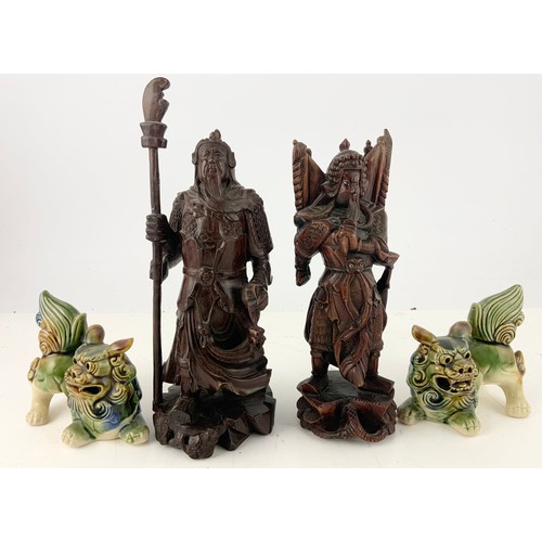 381 - 2 CARVED ORIENTAL FIGURES  TALLEST 30.5cm WITH TWO CERAMIC LION DOG MODELS