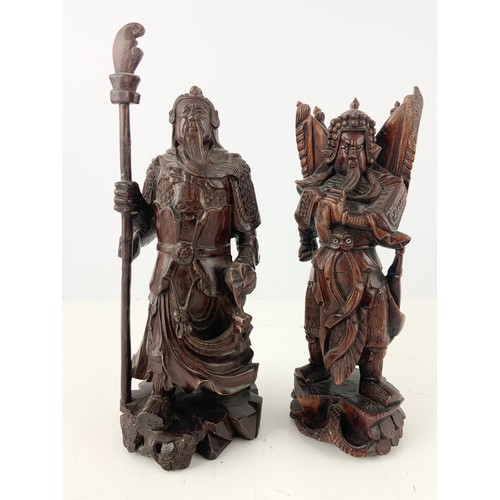 381 - 2 CARVED ORIENTAL FIGURES  TALLEST 30.5cm WITH TWO CERAMIC LION DOG MODELS