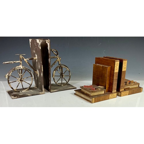 402 - 2 SETS OF BOOKENDS - ONE BASED ON BICYCLES AND THE OTHER BASED ON TOOLS AND EQUIPMENT