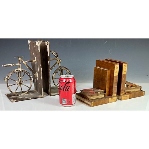 402 - 2 SETS OF BOOKENDS - ONE BASED ON BICYCLES AND THE OTHER BASED ON TOOLS AND EQUIPMENT