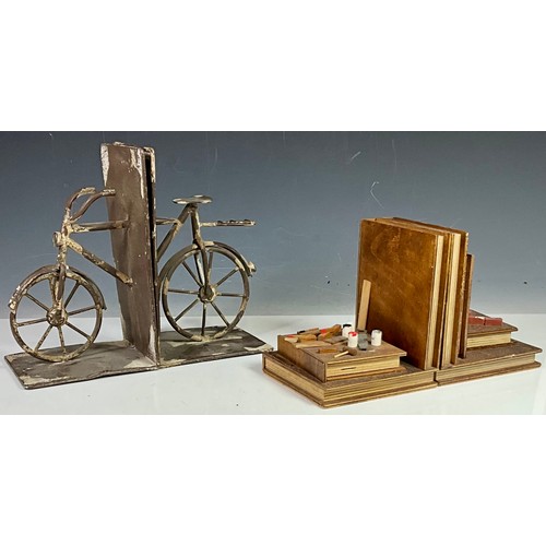 402 - 2 SETS OF BOOKENDS - ONE BASED ON BICYCLES AND THE OTHER BASED ON TOOLS AND EQUIPMENT