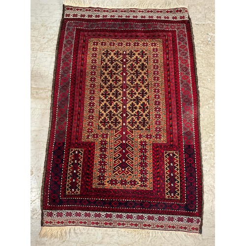 753 - 2 RED GROUND RUGSWITH EASTERN DESIGN LARGEST 134cm x 87cm