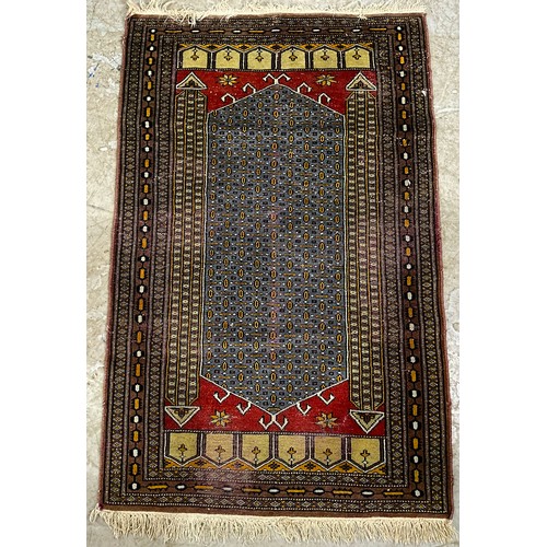 753 - 2 RED GROUND RUGSWITH EASTERN DESIGN LARGEST 134cm x 87cm