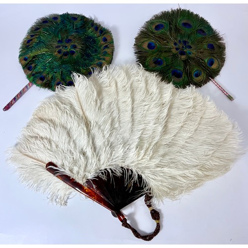 TWO PEACOCK FEATHER OPERA FANS AND AN OSTRICH FEATHER OPERA FAN