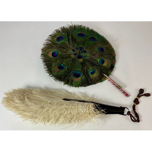TWO PEACOCK FEATHER OPERA FANS AND AN OSTRICH FEATHER OPERA FAN