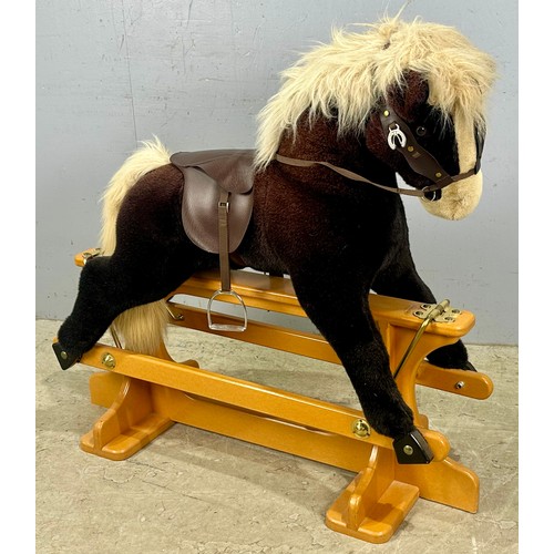 A MERRYTHOUGHT ROCKING HORSE ON TRESTLE STAND