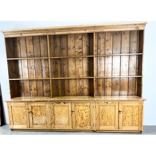 IMPRESSIVE PINE LIBRARY BOOKCASE WITH THREE DOUBLE DOOR CUPBOARDS AND SHELVING ABOVE WIDTH 277cm , 210cm TALL. PINE  DRESSER