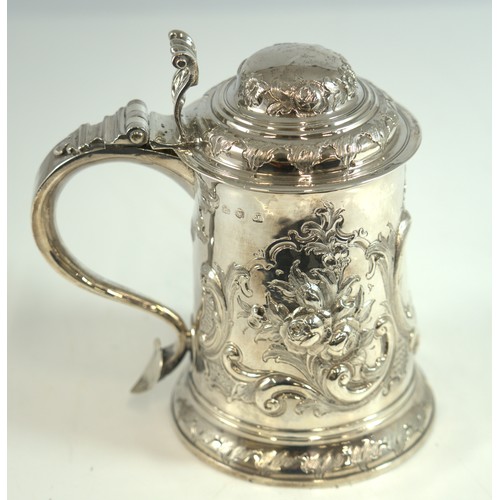 MAGNIFICENT EARLY GEORGE III SILVER TANKARD, REPOUSSÉ FLORAL AND SCROLL DECORATION TO THE BODY AND DOMED LID, WITH SCROLL HANDLE AND FLARED THUMBPIECE   19.5cm. HALLMARKED LONDON 1761 , ETCHED TO BASE 'WHISTLER, 11 THE STRAND LONDON',  808g