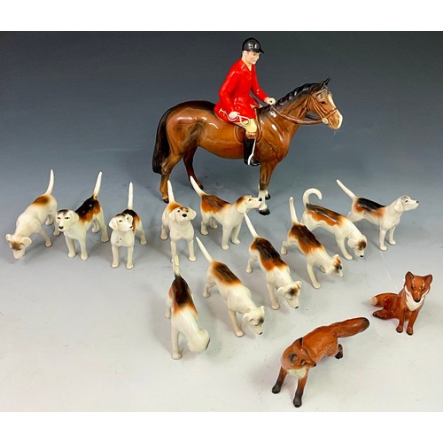 92 - A BESWICK FOX HUNT INTEREST SET WITH MOUNTED HUNTSMAN HOUNDS AND FOXES (14)
