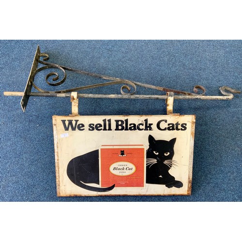 A DOUBLE SIDED PICTORIAL METAL ADVERTISING SIGN, WE SELL BLACK CATS, WITH PICTURE OF A BLACK CAT & CRAVEN BLACK CAT CIGARETTE PACKET. APPROX 66 X 50 CM. WITH HANGING WALL ATTACHMENT