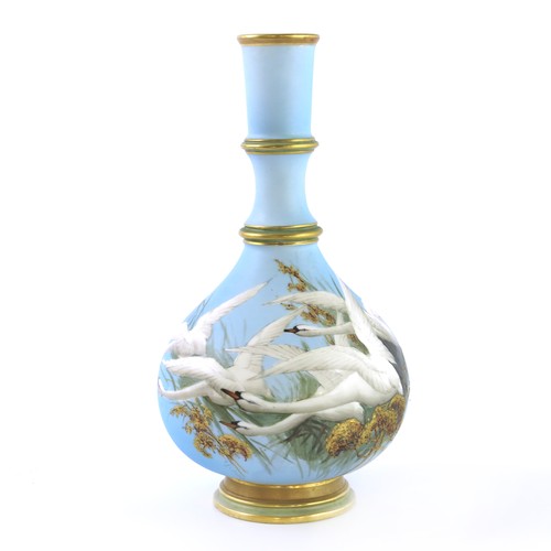 STUNNING  ROYAL WORCESTER VASE DECORATED WITH FIVE SWANS ON A POWDER BLUE GROUND  SIGNED C H C BALDWYN  SHAPE No  1163  23cm TALL