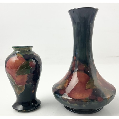 14 - TWO MOORCROFT POTTERY VASES DECORATED IN THE POMEGRANATE PATTERN BOTH WITH SIGNATURE MARKS TO BASE T... 