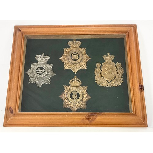 45 - 4 HELMET PLATES IN A FRAME FOR DISPLAY