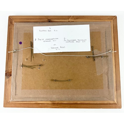 45 - 4 HELMET PLATES IN A FRAME FOR DISPLAY