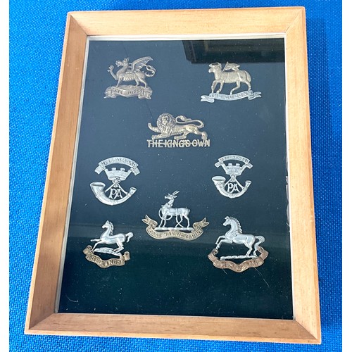 43 - COLLECTION OF MILITARY CAP BADGES, FRAMED FOR DISPLAY