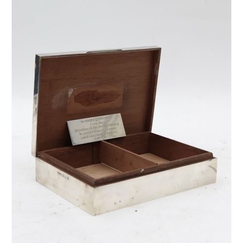 29 - An Elizabeth II silver cigarette box,by Harman Brothers, Birmingham 1972, the interior with engine-t... 
