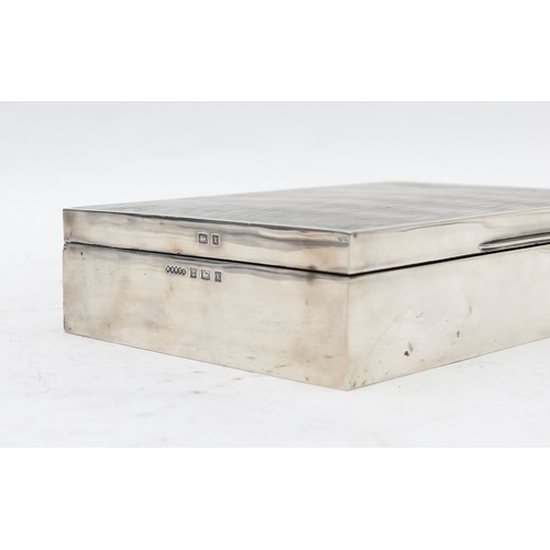 29 - An Elizabeth II silver cigarette box,by Harman Brothers, Birmingham 1972, the interior with engine-t... 