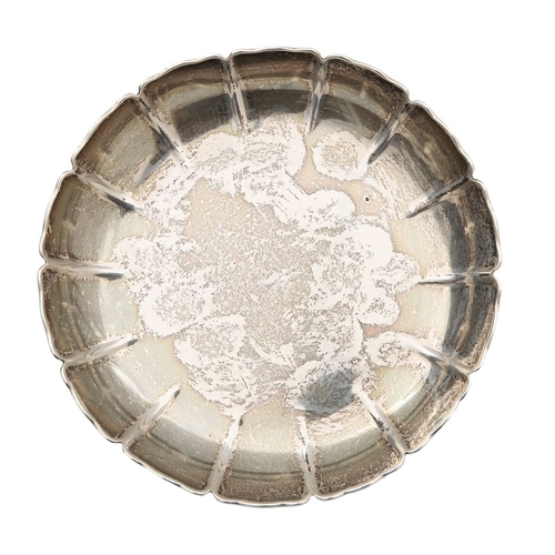 41 - A George V silver strawberry dish and seven Elizabeth II silver napkin ringsthe tripod dish with fol... 