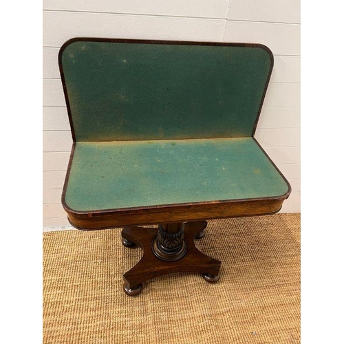 102 - A George IV style card table with rectangular top folding to enclose a blaze on turned column (H74cm... 