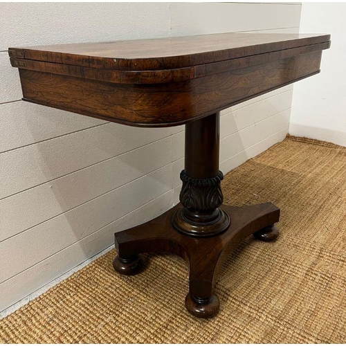 102 - A George IV style card table with rectangular top folding to enclose a blaze on turned column (H74cm... 