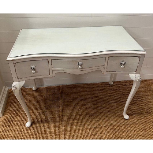123 - A white painted dressing table with three drawers and cabriole legs (H75cm W98cm D51cm)