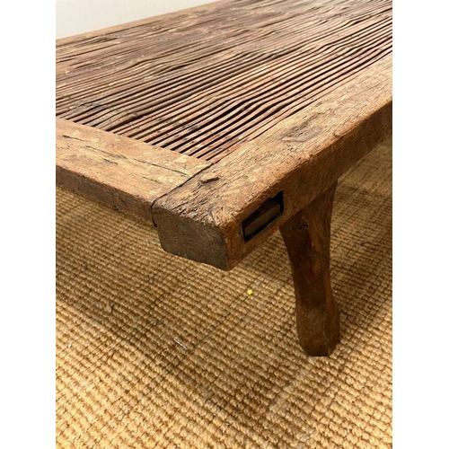 129 - A North African reclaimed panel converted into a large low table or day bed height 38cm and  205X114