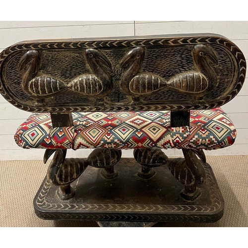 137 - A South African carved bench seat with a Kilim style, upholstered and four carved birds to back and ... 