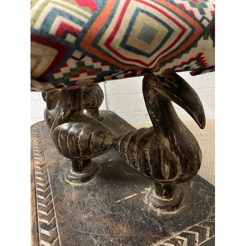 137 - A South African carved bench seat with a Kilim style, upholstered and four carved birds to back and ... 