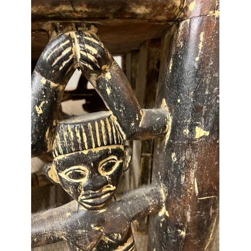 139 - A pair of carved seats with tribal theme carving to back and base