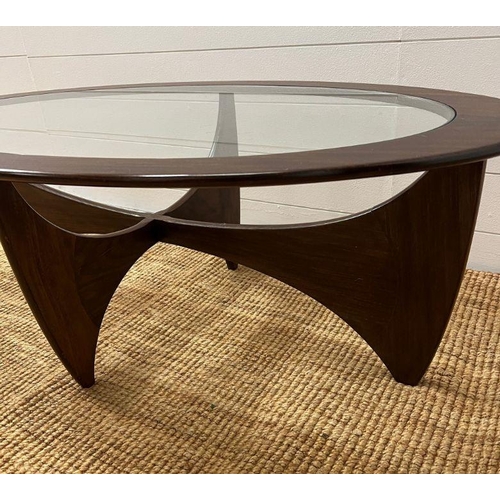 145 - A G-Plan Astro oval table with glass top (H42cm W122cm D66cm)