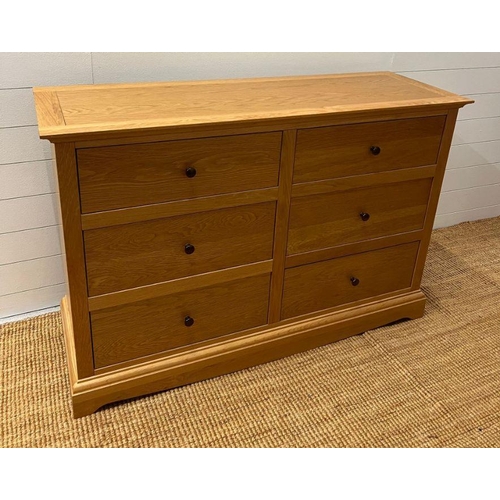 149 - A light oak chest of drawers along with a single bedside (H88cm W132cm D45cm) (Bedside H68cm W51cm D... 