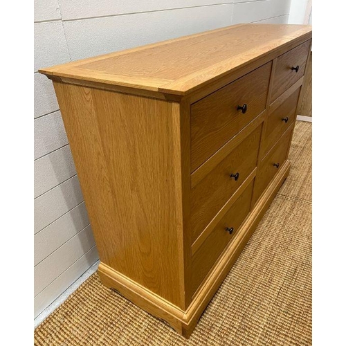 149 - A light oak chest of drawers along with a single bedside (H88cm W132cm D45cm) (Bedside H68cm W51cm D... 