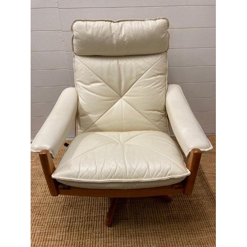 154 - A pair of Norwegian Lied Mobler teak and white leather revolving and reclining chairs
