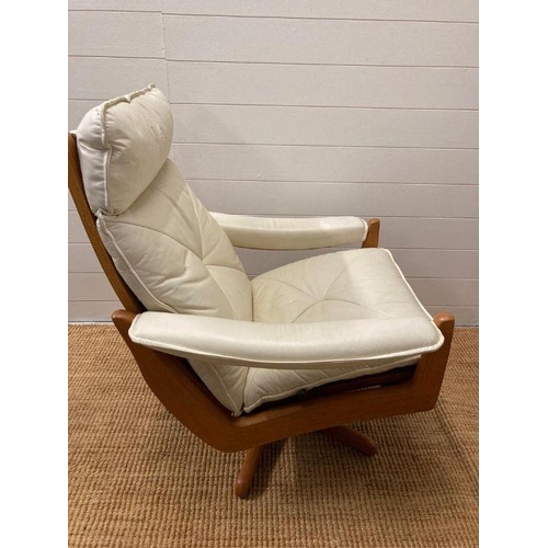 154 - A pair of Norwegian Lied Mobler teak and white leather revolving and reclining chairs