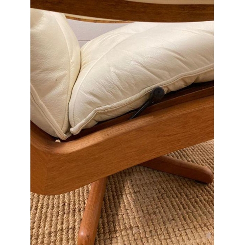 154 - A pair of Norwegian Lied Mobler teak and white leather revolving and reclining chairs