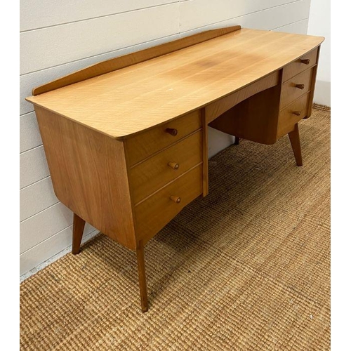 159 - A Mid Century dressing table on tapering legs (H67cm W122cm D49cm)