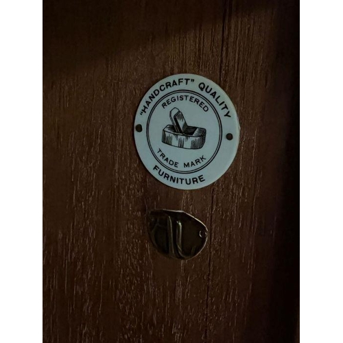 165 - A teak Mid Century wardrobe, hanging rail to left and shelves to right (H150cm W95cm D59cm)