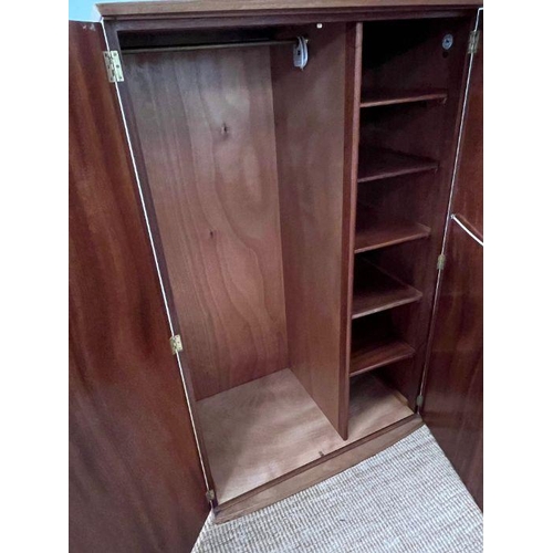 165 - A teak Mid Century wardrobe, hanging rail to left and shelves to right (H150cm W95cm D59cm)
