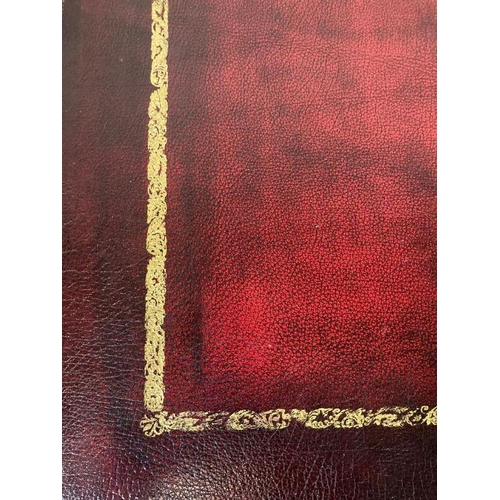 173 - An oak pedestal desk with red leather top and brass drop handles (H78cm W136cm D76cm)