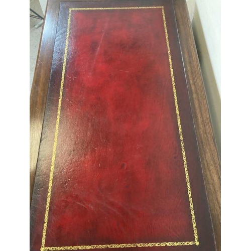 173 - An oak pedestal desk with red leather top and brass drop handles (H78cm W136cm D76cm)