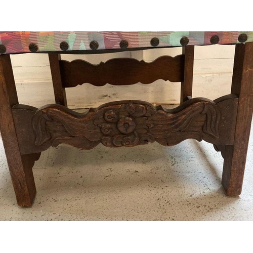 178 - A mahogany carved African threaded upholstered chair