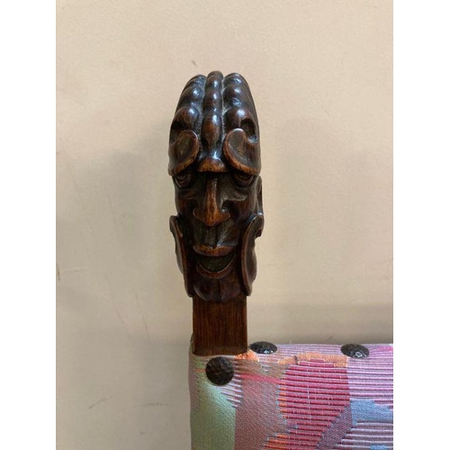 178 - A mahogany carved African threaded upholstered chair