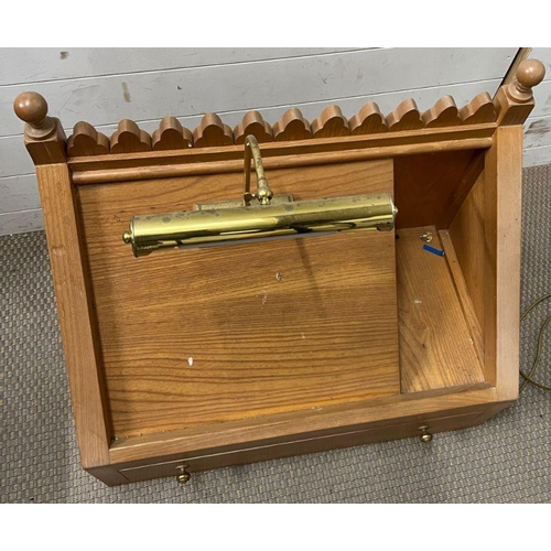 279 - A light oak pulpit with reading light (H65cm W74cm D40cm)