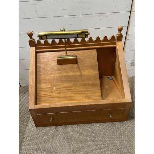 279 - A light oak pulpit with reading light (H65cm W74cm D40cm)
