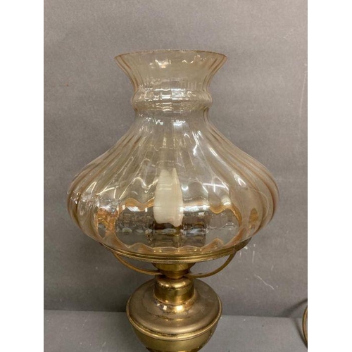 281 - A converted brass oil lamp with iridescent glass shade height 44cm