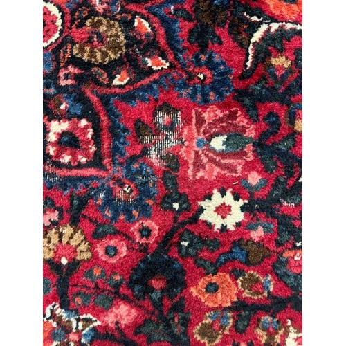 298 - A Hamedan Persian style rug, red grounds 220cm x 140cm